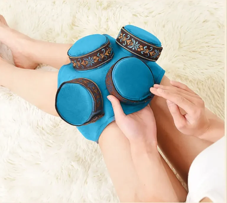 Blue fabric-covered portable moxa holder displayed around a knee
